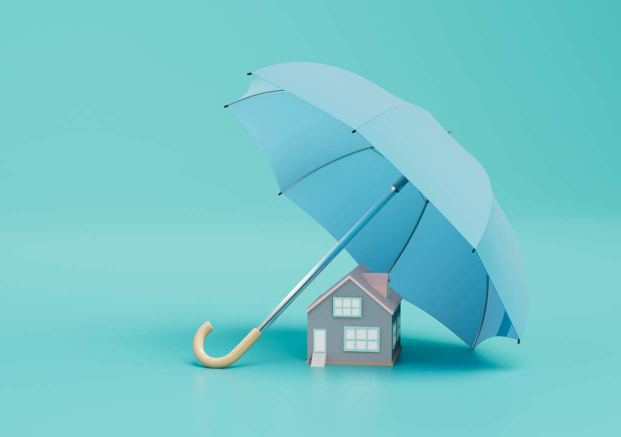 House protected by a large blue umbrella.